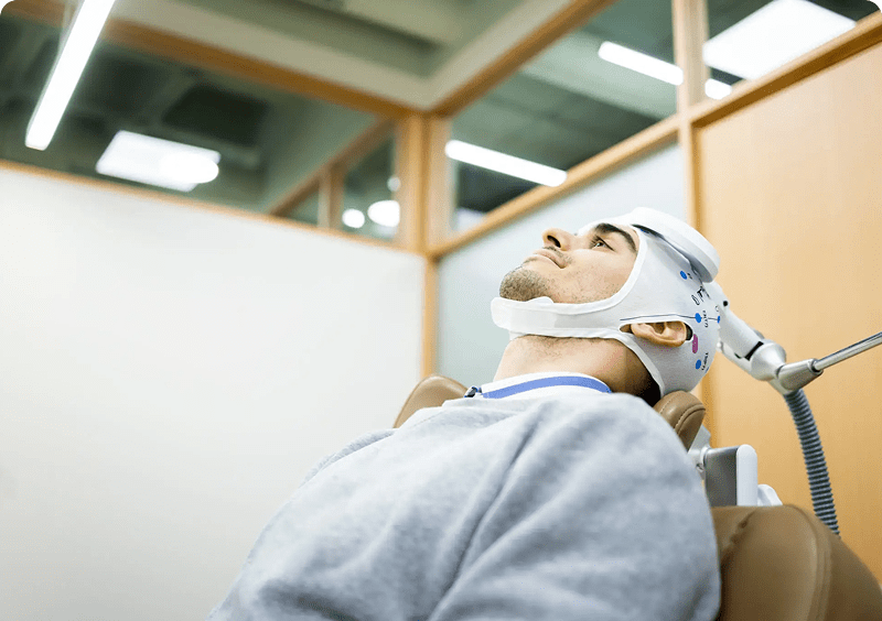 Person undergoing brain stimulation therapy session.