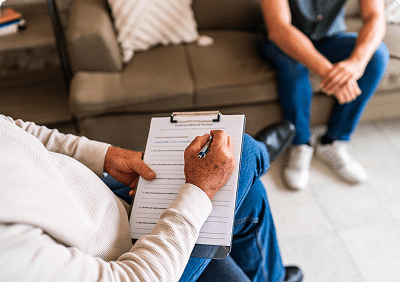 Therapist taking notes during a session.